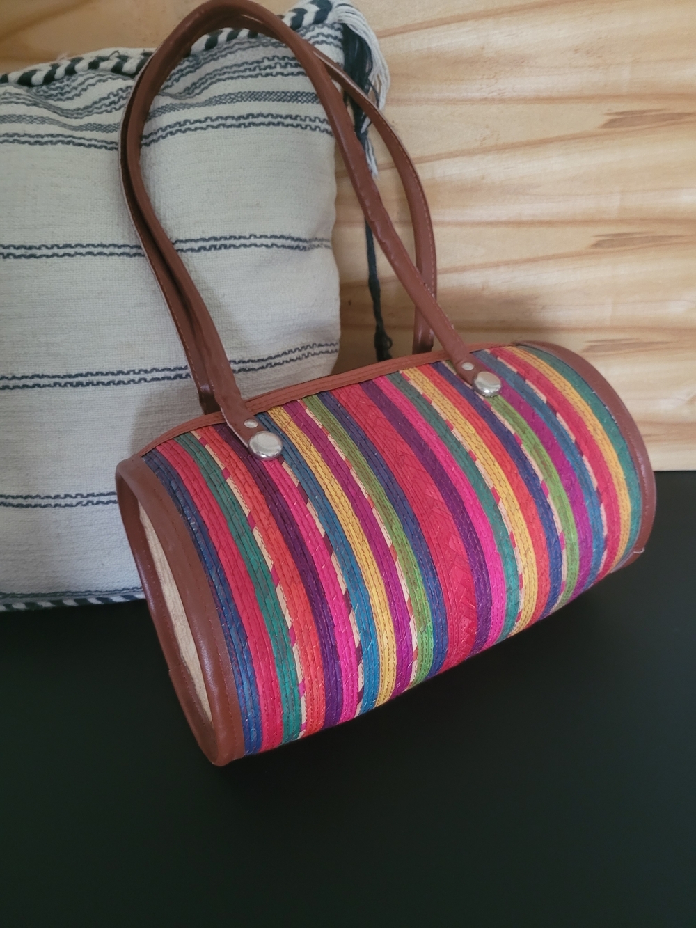 Handmade vintage-style Mexican woven straw barrel bag.